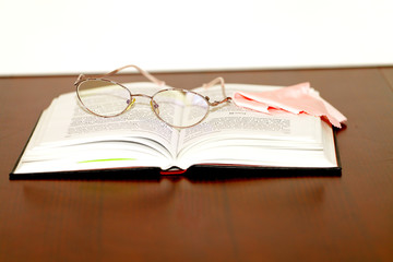 Glasses and book