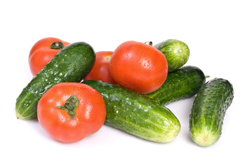 Cucumbers and tomato, isolated on white background