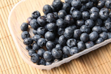 Organic blueberries in a plastic can