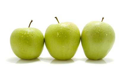 Three juicy green apples isolated on white background