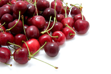 red cherries in closeup isolated on white background