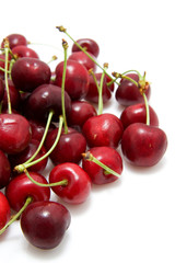 red cherries in closeup isolated on white background