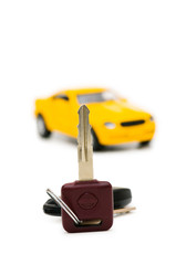 Fototapeta premium Car keys and car at background isolated on white