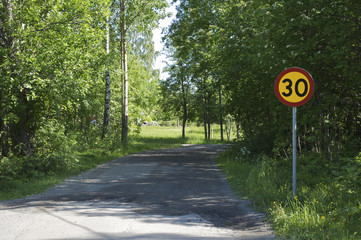 Country road with a sign
