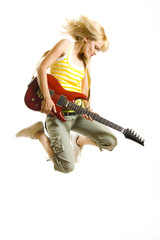 passionate woman guitarist jumps in the air