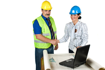 Handshake engineers in office