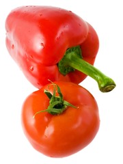 Fresh red pepper and tomato isolated on white background