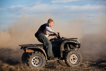 Fototapeta premium teen riding ATV quad
