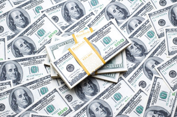 Stack of dollars on money background