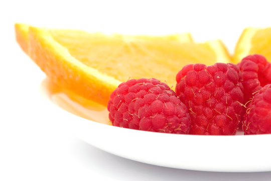 aspberries and sliced orange