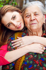Family - happy young woman and grandmother
