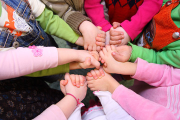 Children stand having joined hands,  top view