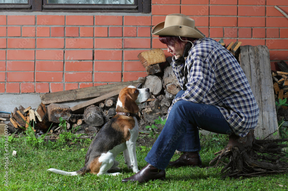 Wall mural rural woman and beagle puppy