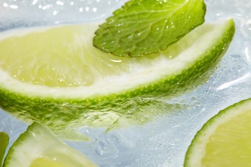 leaf mint and cut citrus in ice