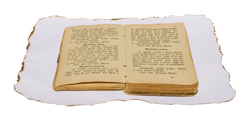 Old book isolated on burned paper.