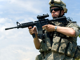 Soldier aiming his rifle
