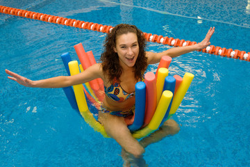 girl in water on aqua noodles