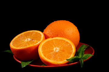 Sliced orange on black background