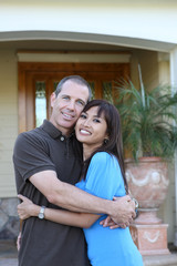 Naklejka premium Attractive diverse couple at home