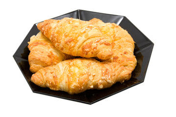 Plate with fresh bakes croissants isolated on white background