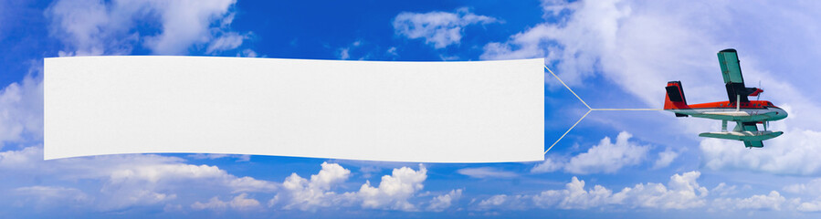 Fototapeta premium Flying airplane and banner