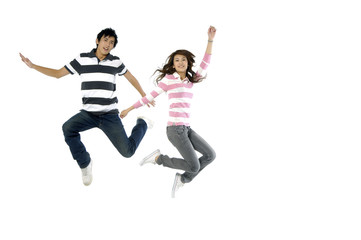 Fototapeta na wymiar happy casual couple jumping of joy