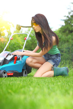 Garden Work, Woman Mowing Grass With Lawnmower