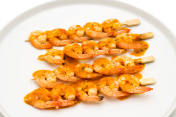 griled shrips with sauce on the plate