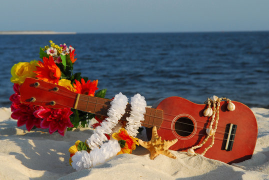 Ukulele on beach - Powered by Adobe