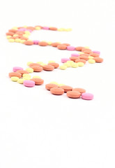 Obraz na płótnie Canvas Twisting path from pills