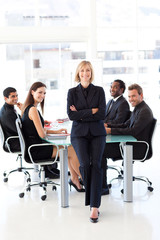 Business team smiling at the camera in a meeting