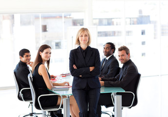 Business team smiling at the camera in an office