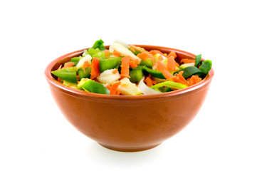 Stone dish with various vegetables on white background