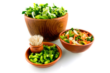 Various dishes with vegetables on white background