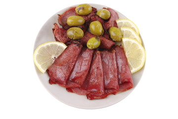 sliced served sausage with raw lemon