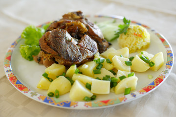 Roasted lamb meat and potatoes