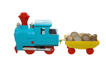 Toy train carrying coins on a white background