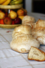 Several breads and bowl of fruit
