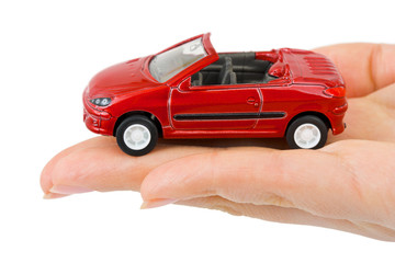 Toy car in hand