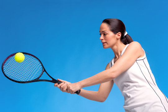 Woman Playing Tennis Forearm Shot
