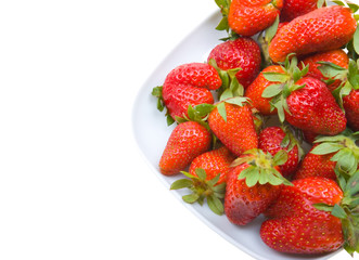 Fresh strawberries on a platter isolated on white