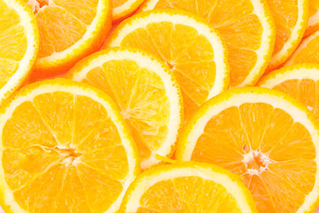 Many sliced oranges background