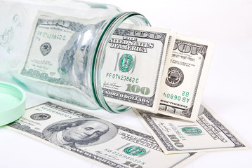 dollar banknotes in the glass jar