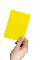 Gelbe Karte in einer Hand