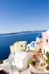 Obraz premium street scene with blue dome church and cyclades architecture san