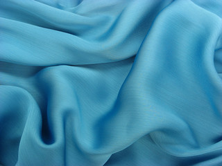 Obraz premium Wrinkled shiny blue fabric