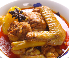 Traditional spicy curry chicken close up