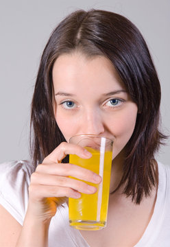 Portrait of beautiful woman with glass of juice