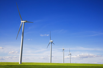 Windmills against blue sky