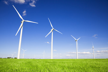 Windmills against blue sky